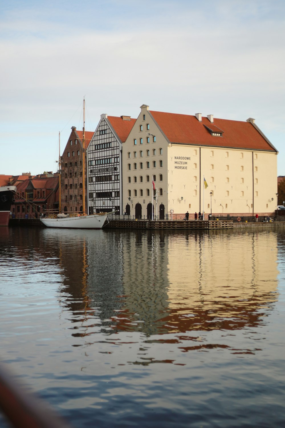 a building next to a body of water