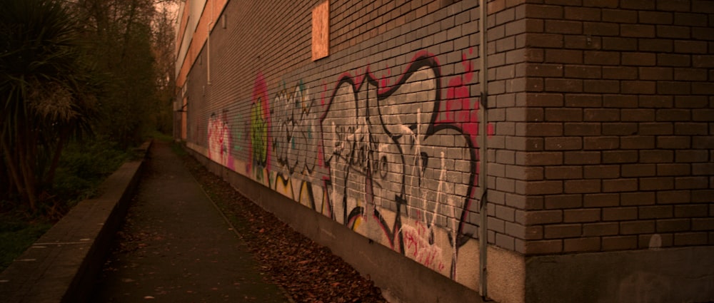 a brick wall with graffiti