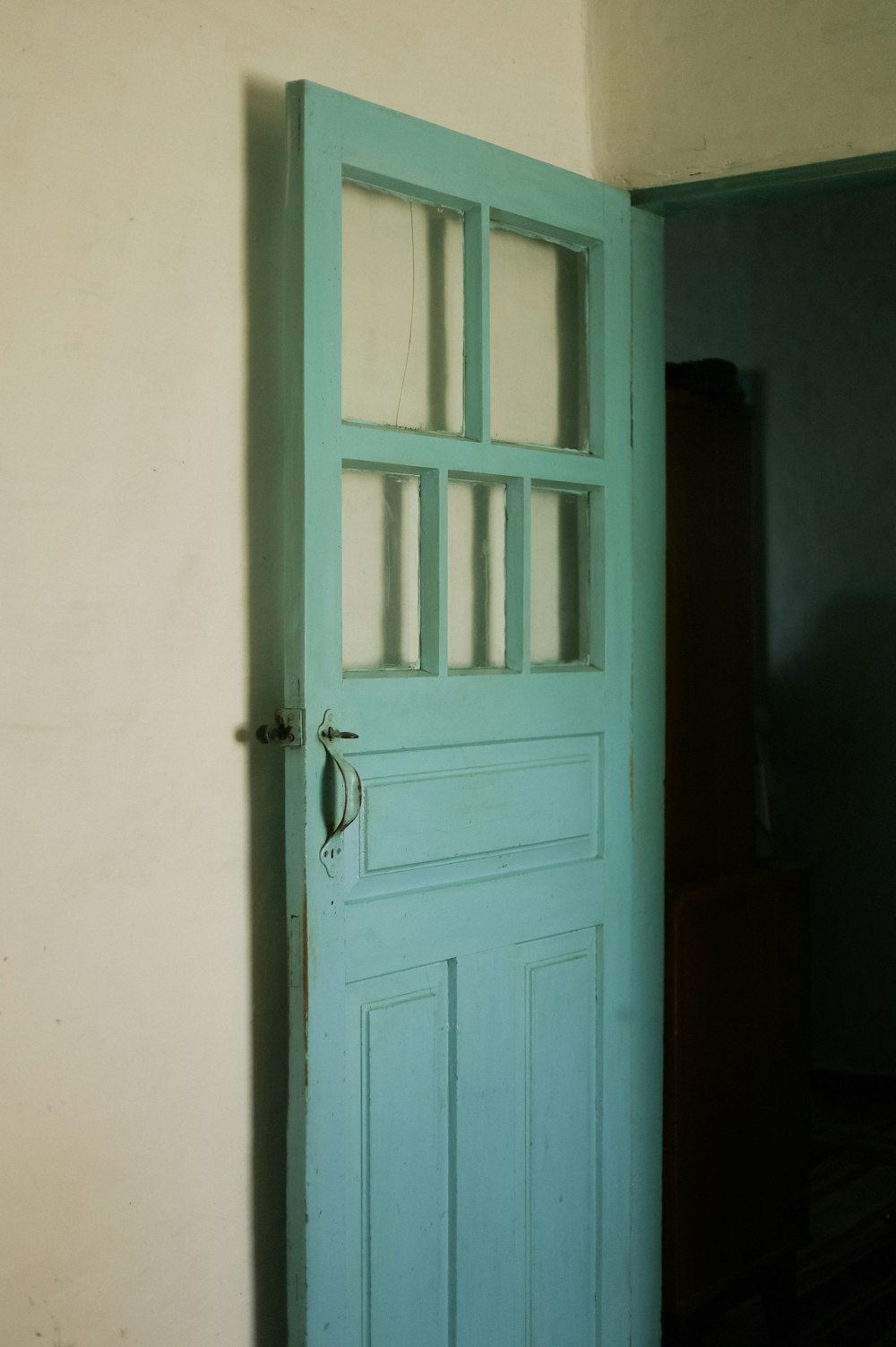 a blue door with a window