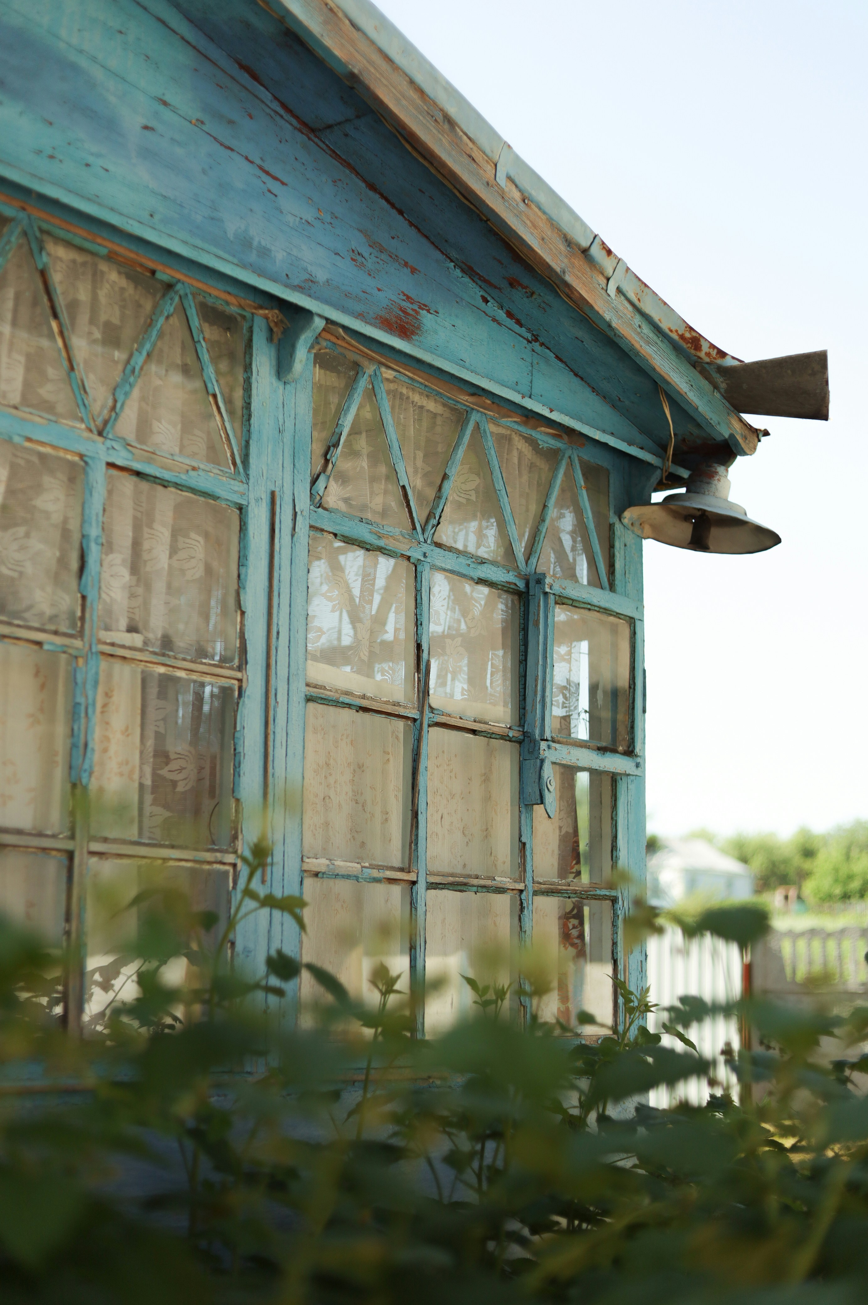 a green house with a light