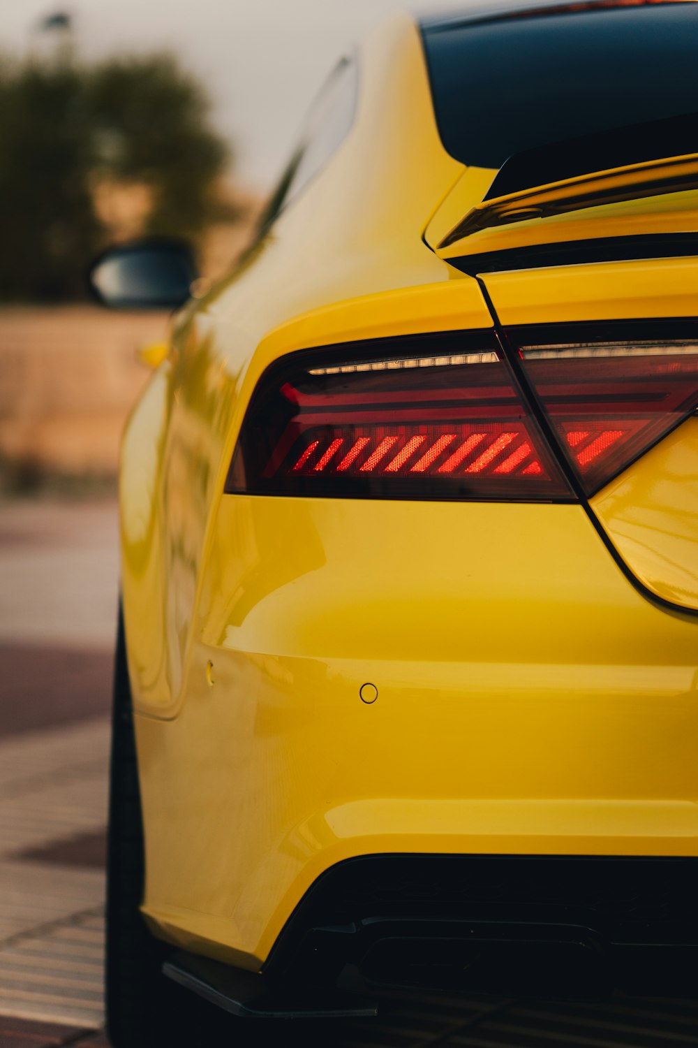 the back of a yellow car