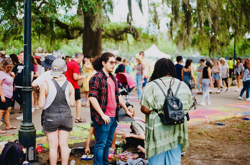 a group of people walking in a park