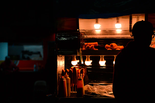 Happy customers enjoying churros and dipping sauces at a modern fast-food style counter.