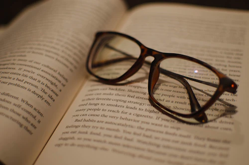 Glasses resting on an open book