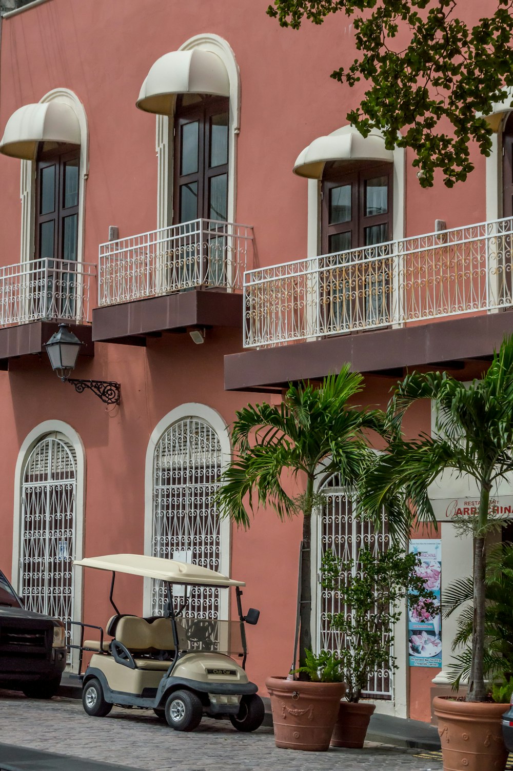 a golf cart parked outside a building