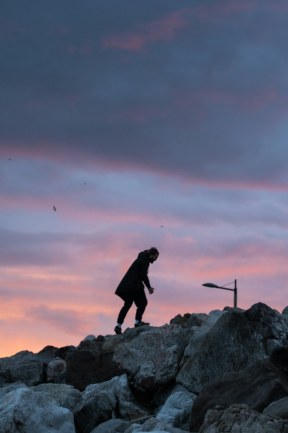 a person standing on rocks