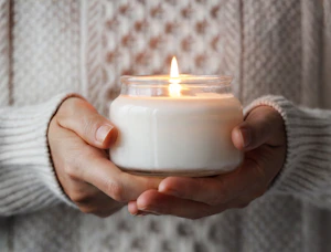 a person holding a candle