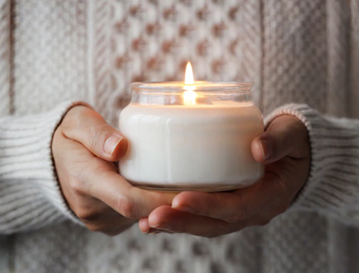 a person holding a candle