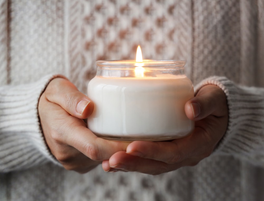 a person holding a candle