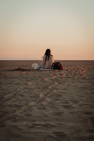 a person sitting on a beach