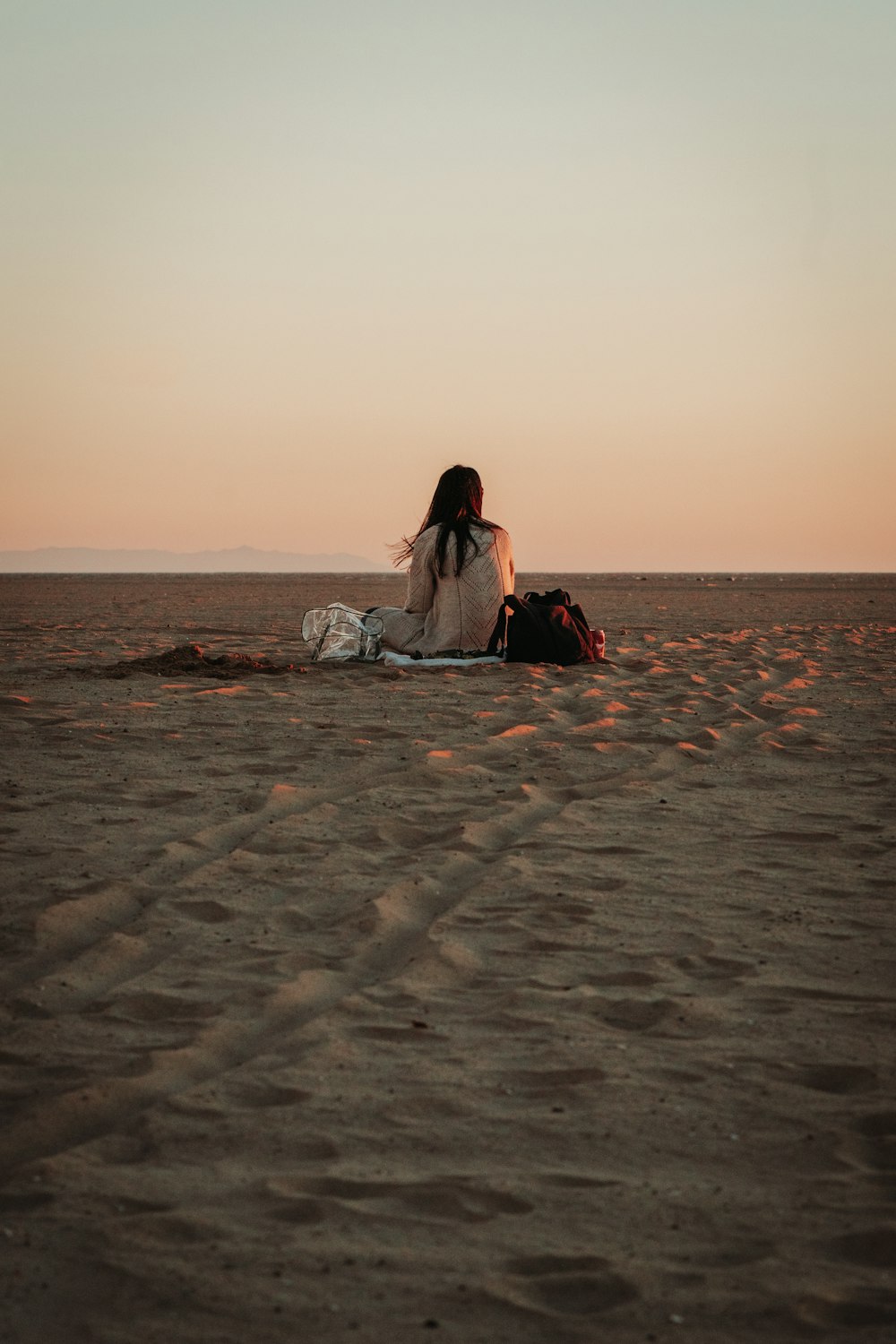 a person sitting on a beach