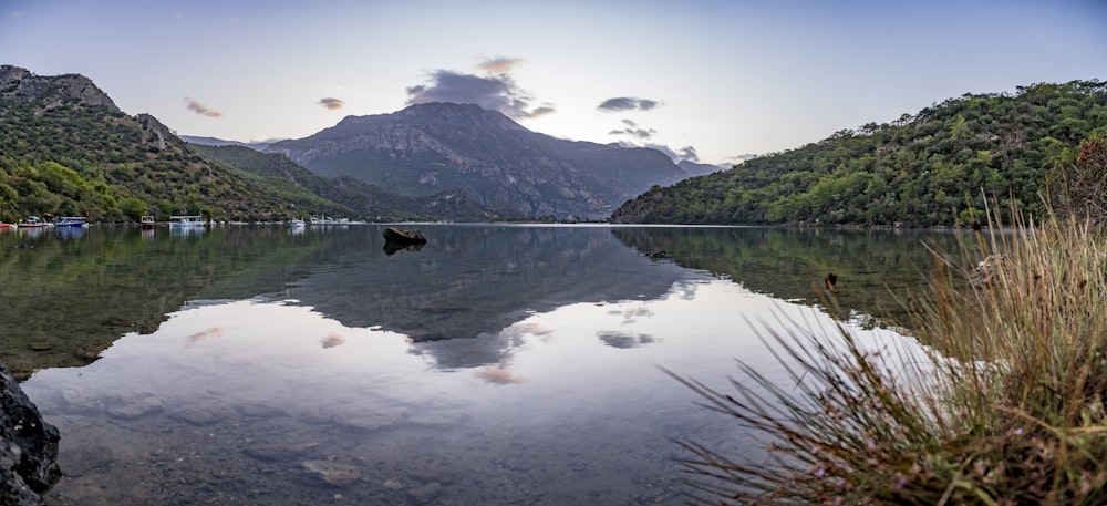 a body of water with mountains in the background