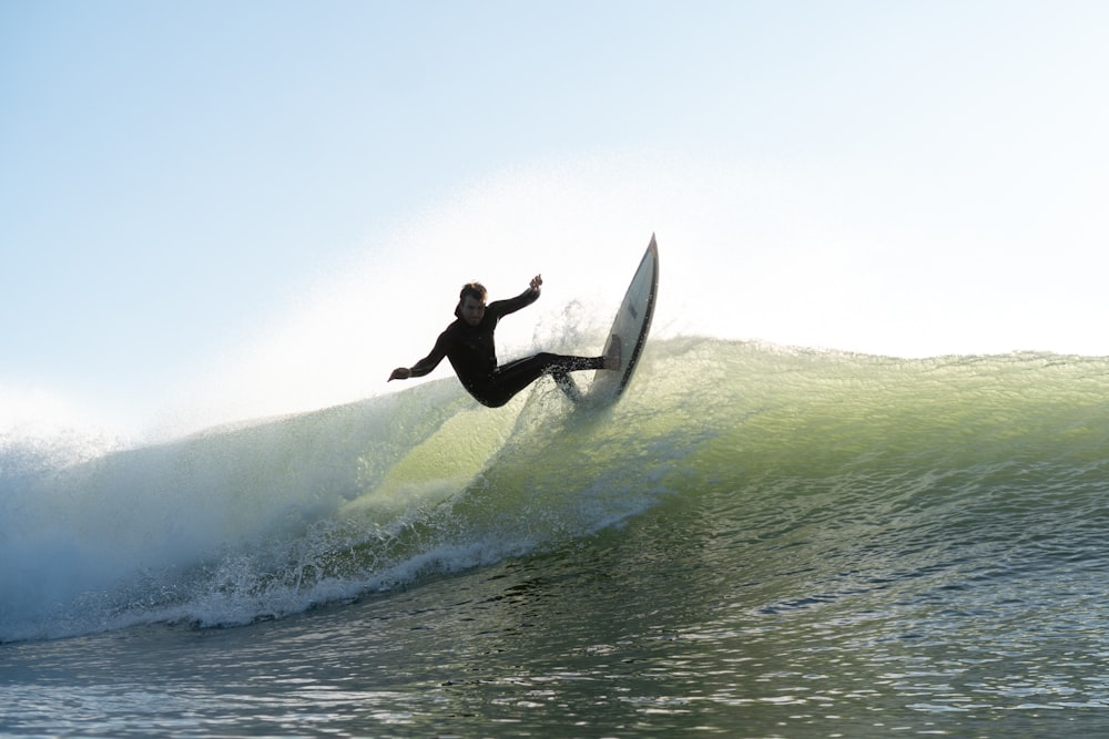 a man riding a surfboard