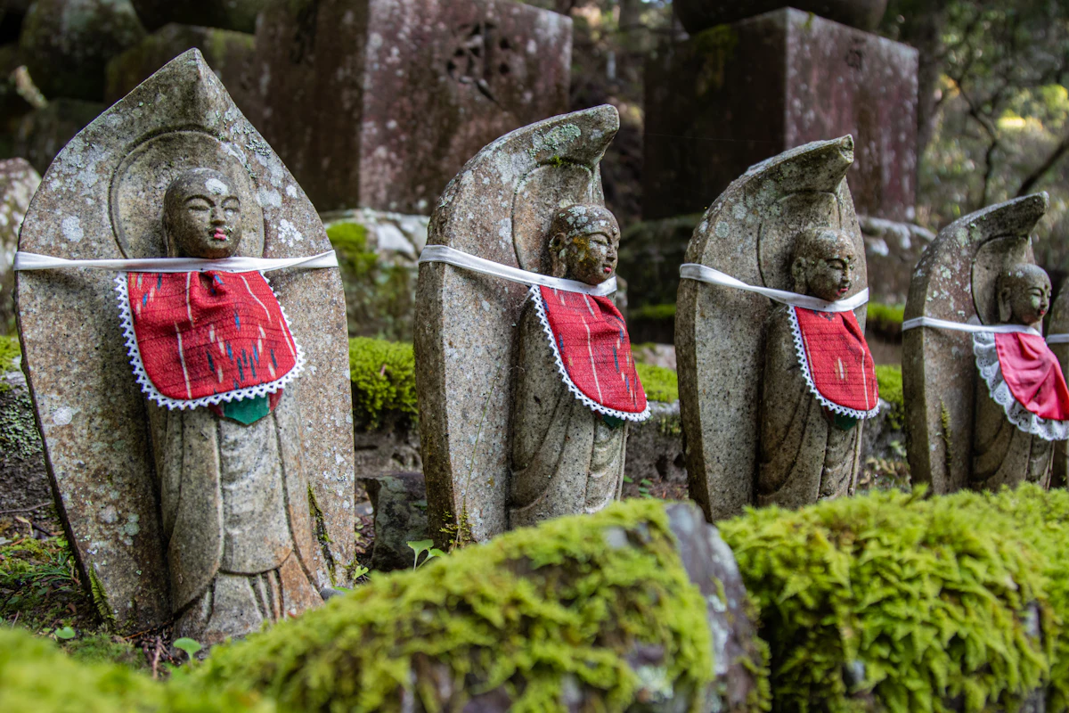 Stone statues in robes among the graves of Okunoin