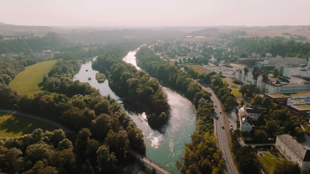 a river with a bridge and trees