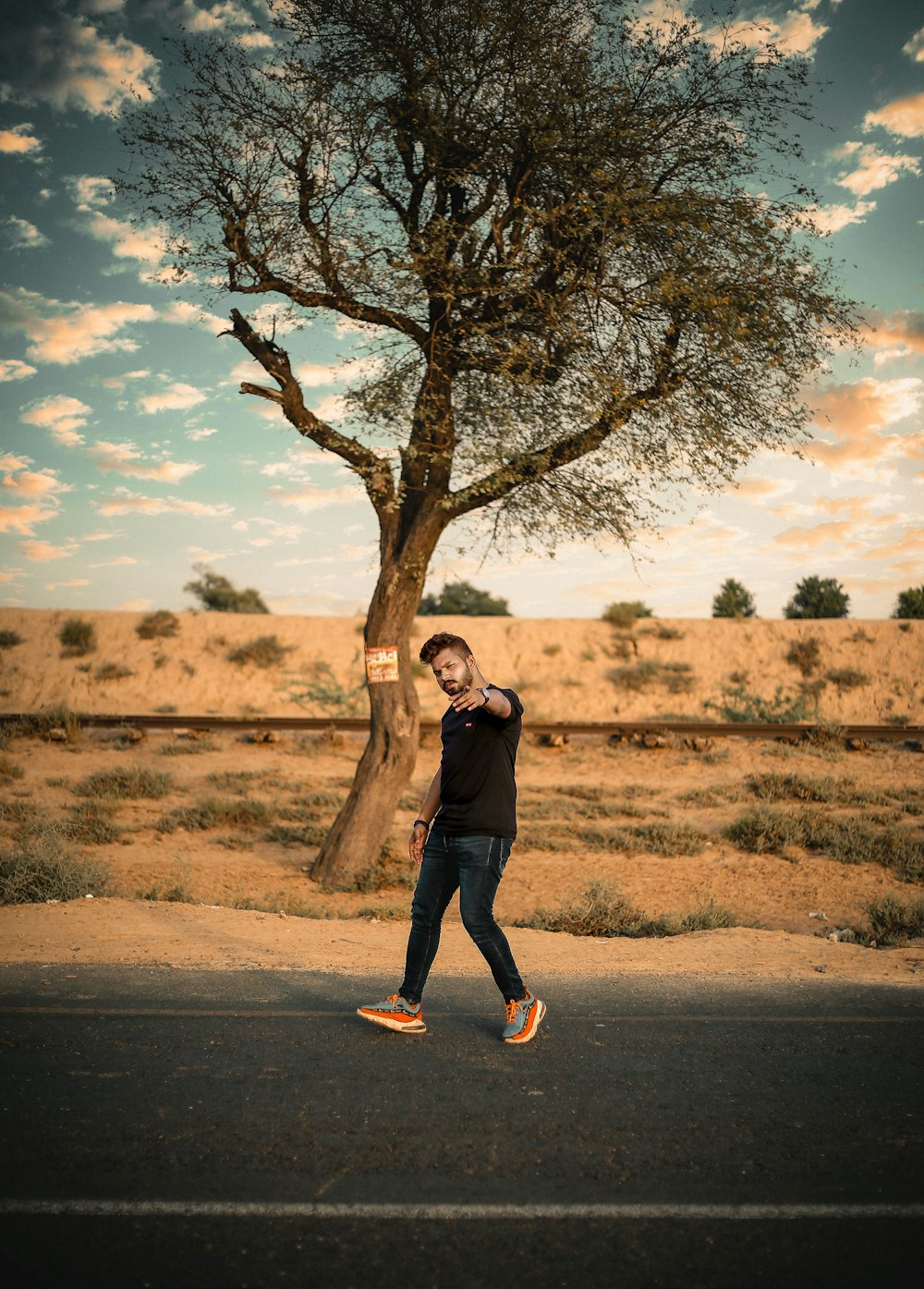 a person standing next to a tree