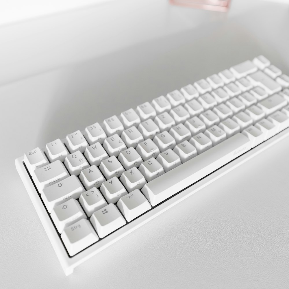 a white keyboard on a white surface