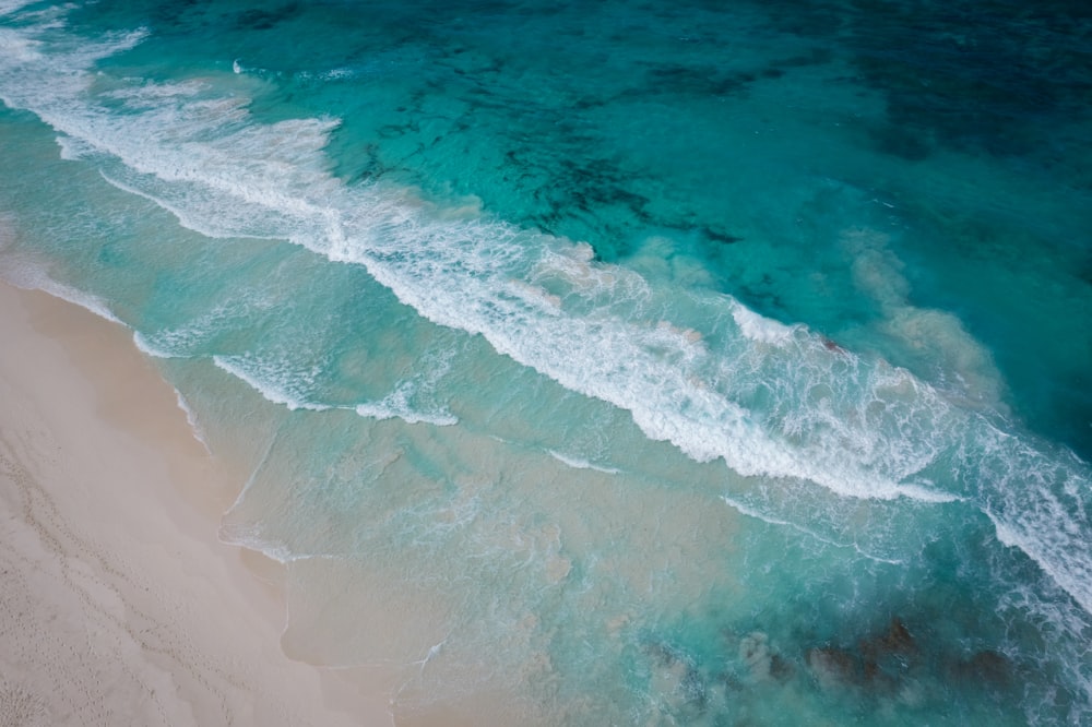 a wave crashing on a beach