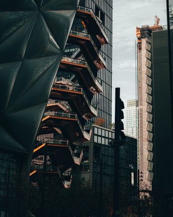 Modern urban architecture with overlay of data analytics graphs and interface elements.