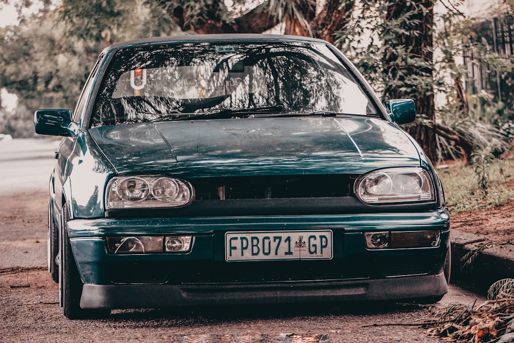 a car parked on a dirt road