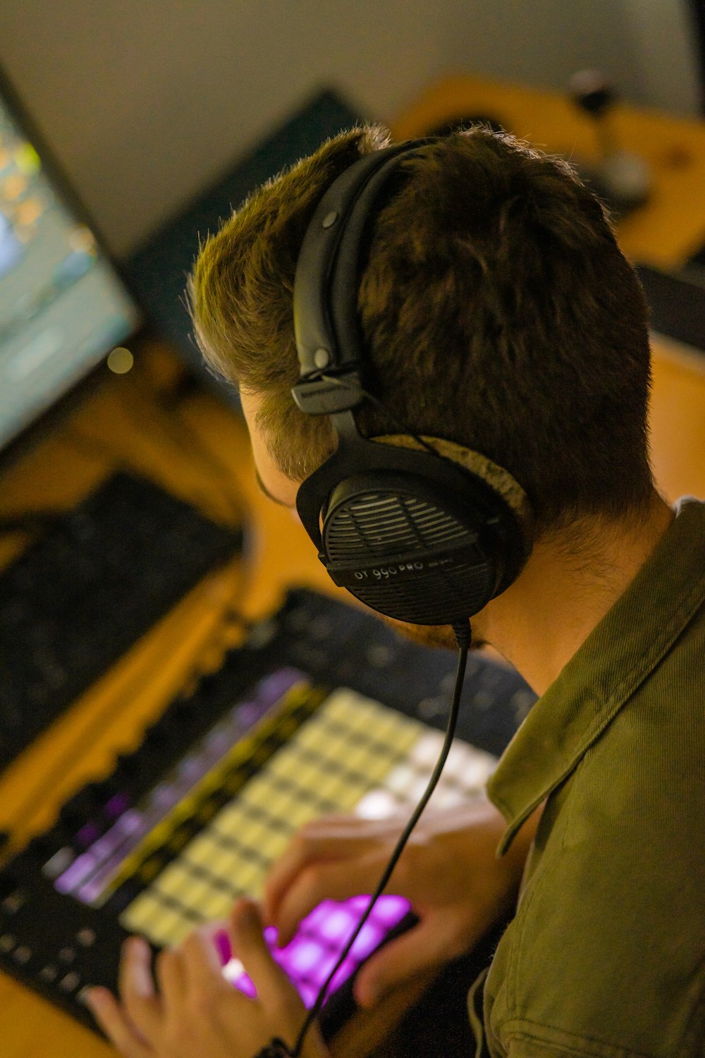 a person wearing headphones and playing a guitar