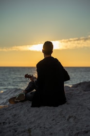 a person sitting on a beach