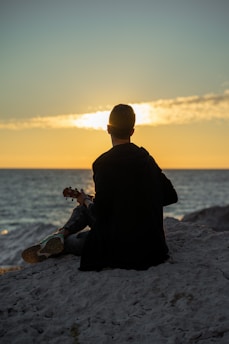 a person sitting on a beach