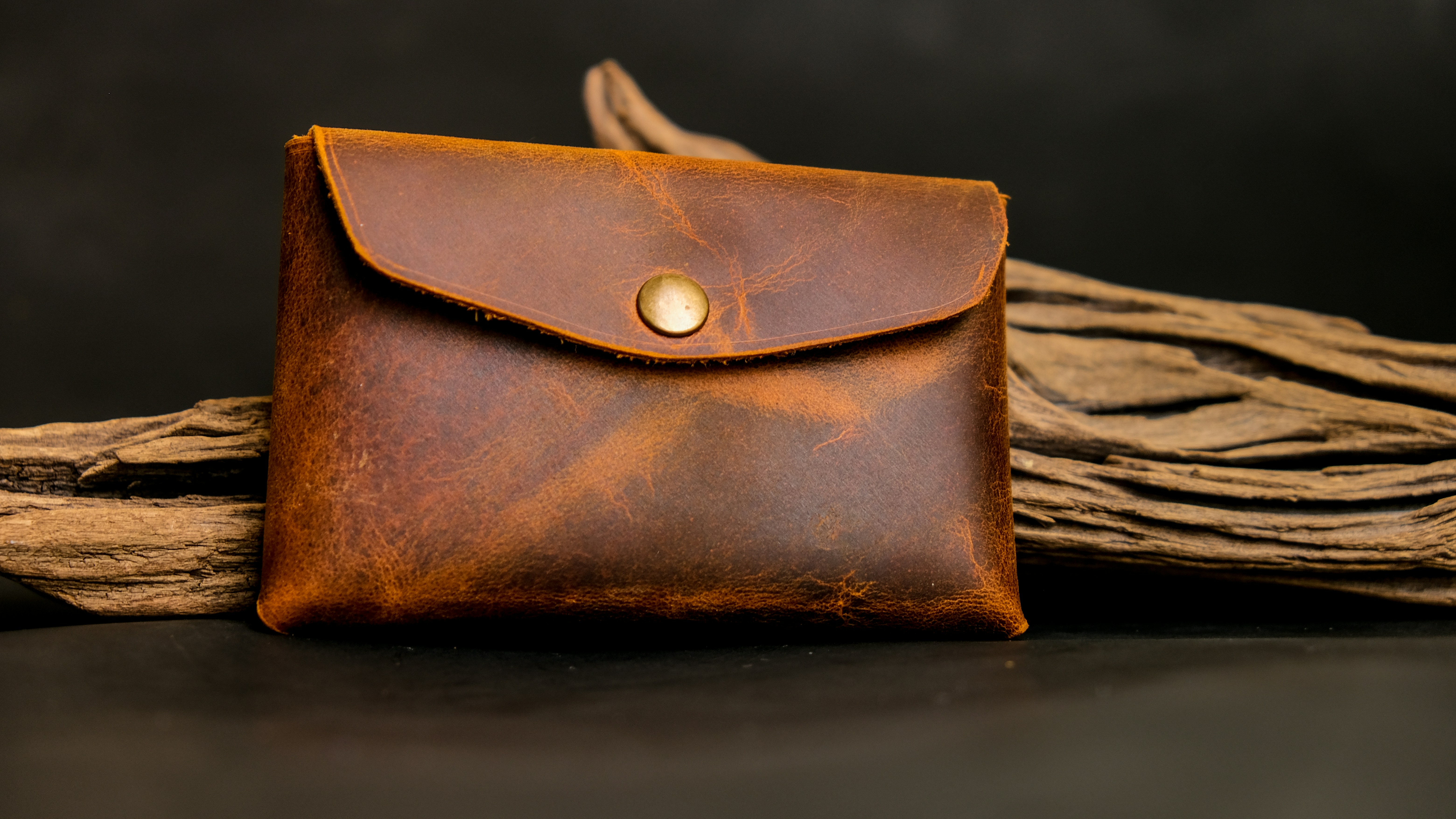 a brown leather purse