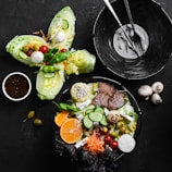 A colorful array of salads with various dressings.