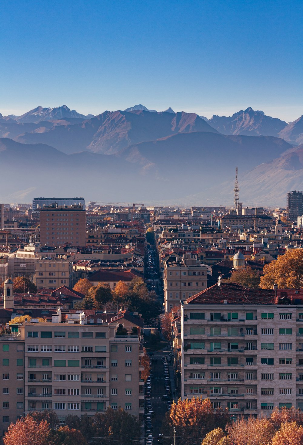 a city with a mountain in the background