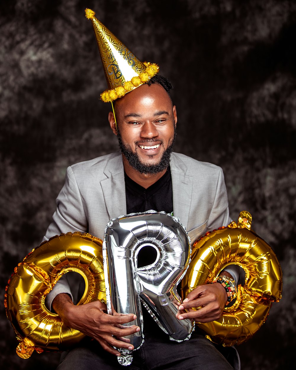 a person wearing a crown and holding a gold trophy