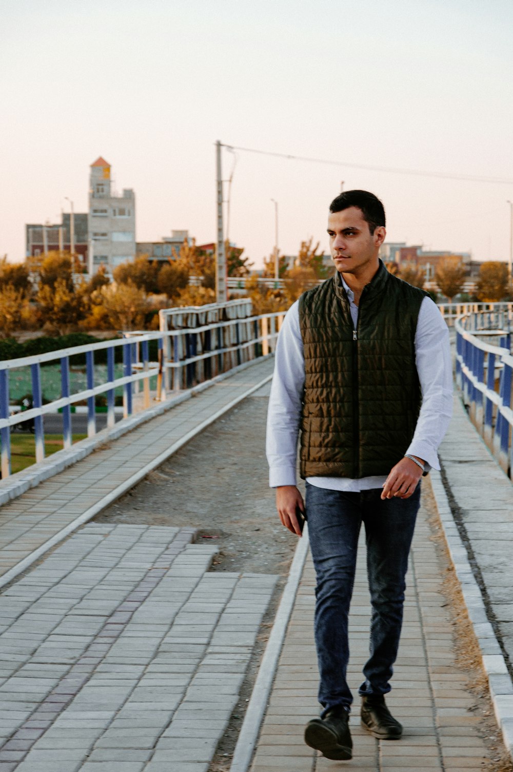 a man standing on a bridge