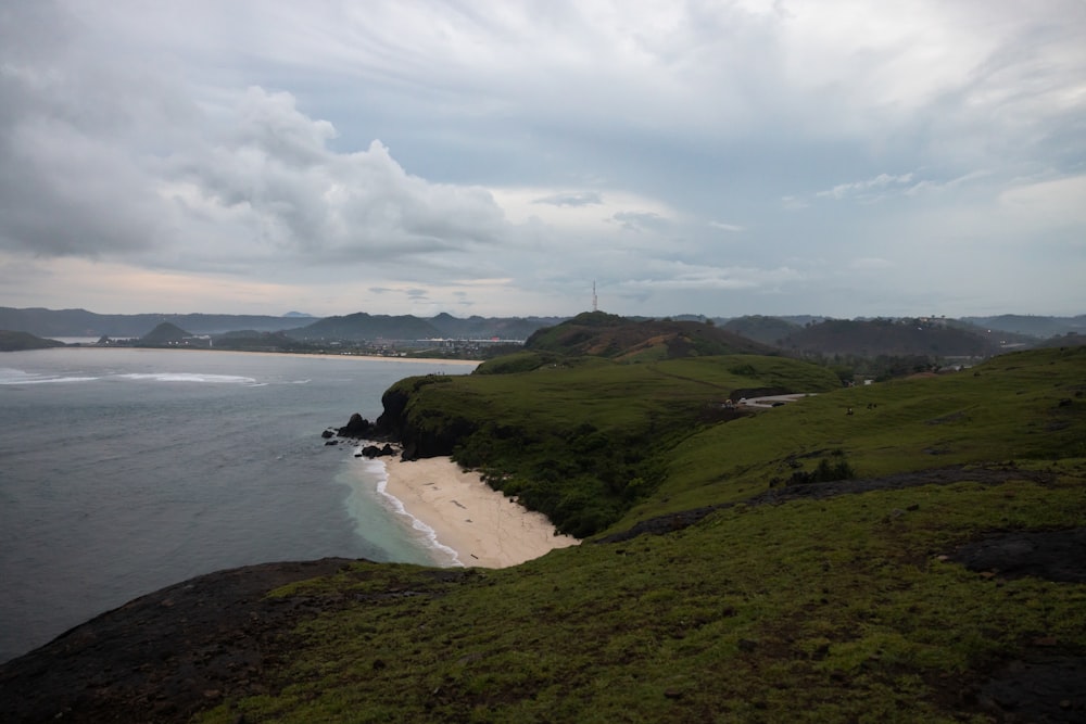 a beach with a body of water by it