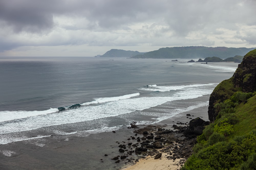 a beach with waves crashing on it