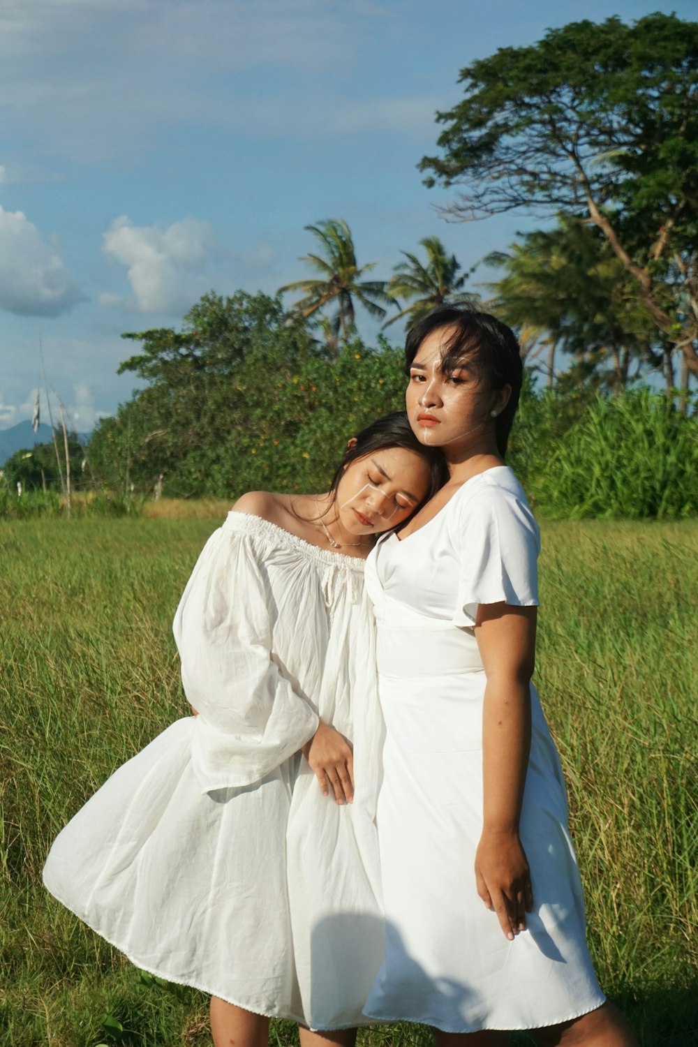 a person in a white dress and a person in a white dress