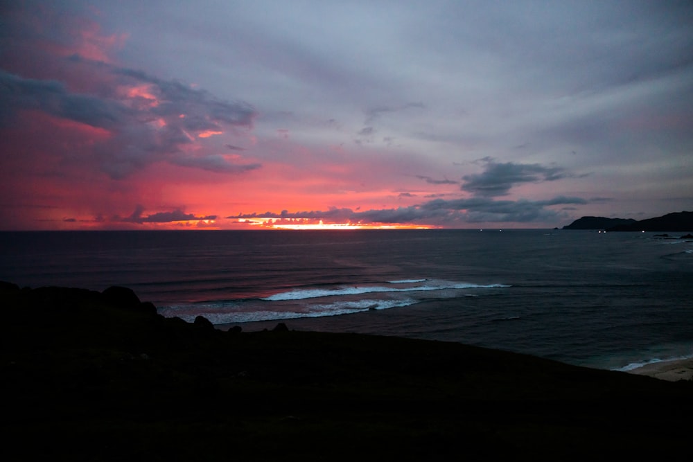 a beach with a sunset