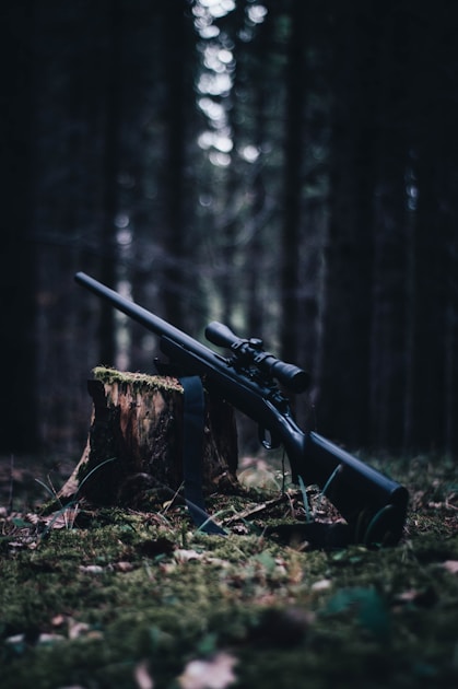 Large whitetail shed antler found on forest floor with leaves and natural ground cover in early spring