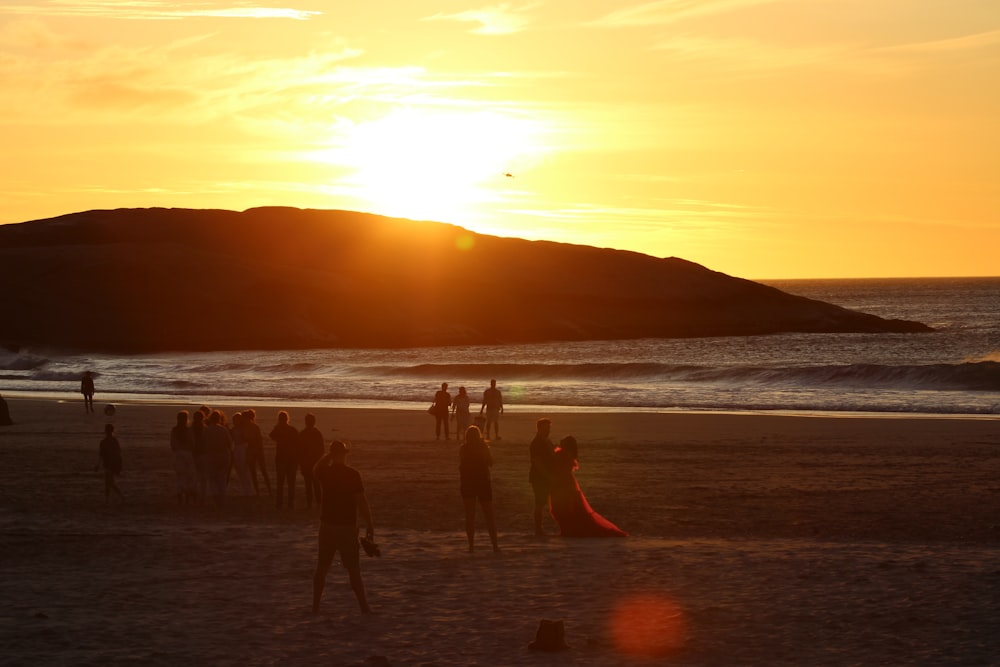 a group of people on a beach