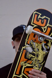 a man holding a skateboard