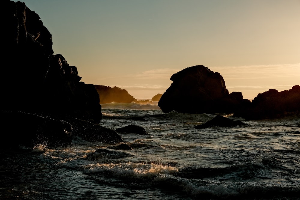 a body of water with rocks in it