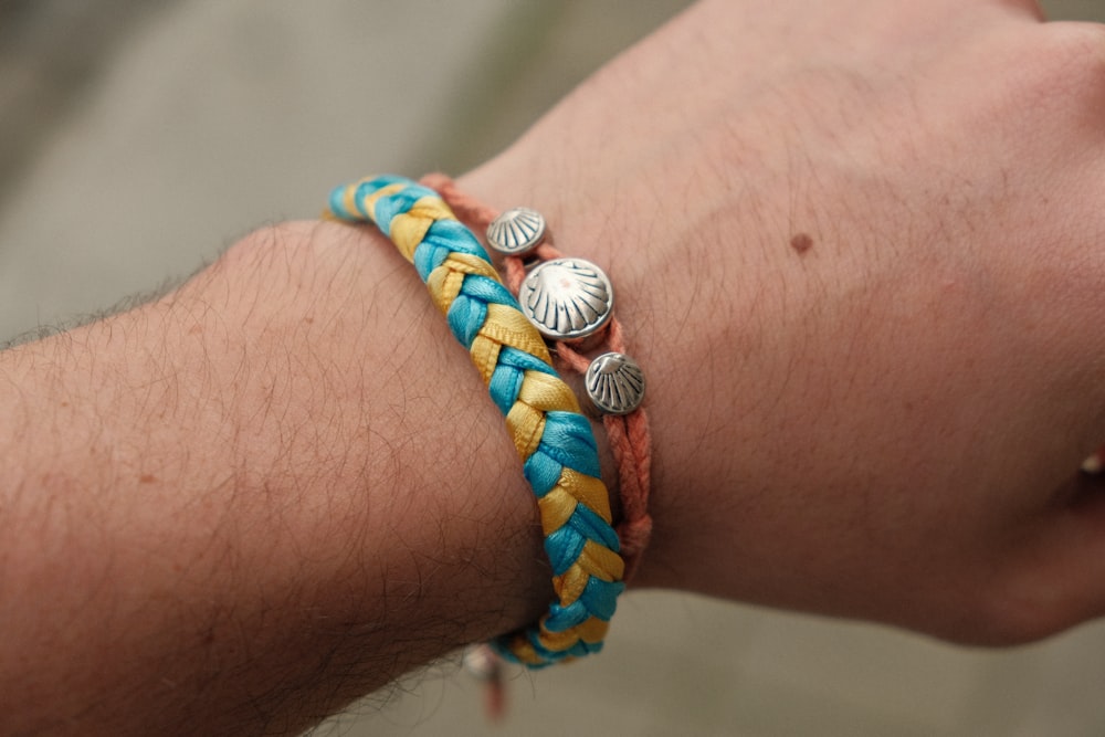 a person wearing a colorful bracelet