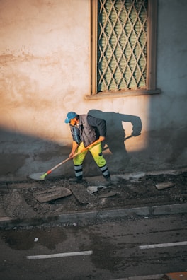 a person sweeping the street