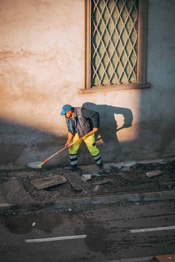 a person sweeping the streetby okeykat