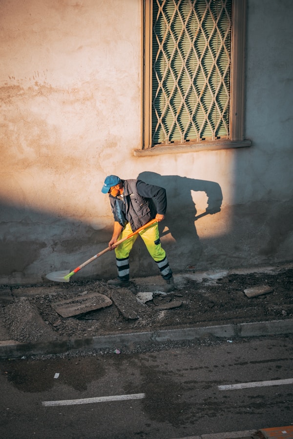 a person sweeping the streetby okeykat