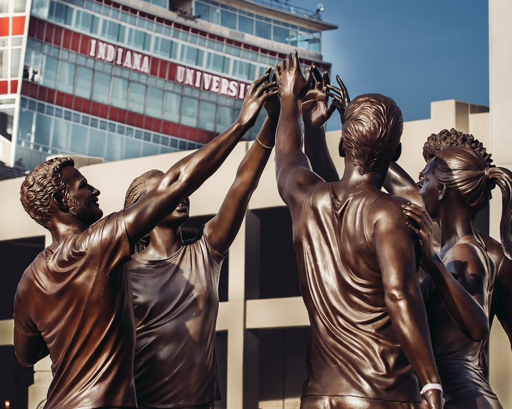 a group of statues of people