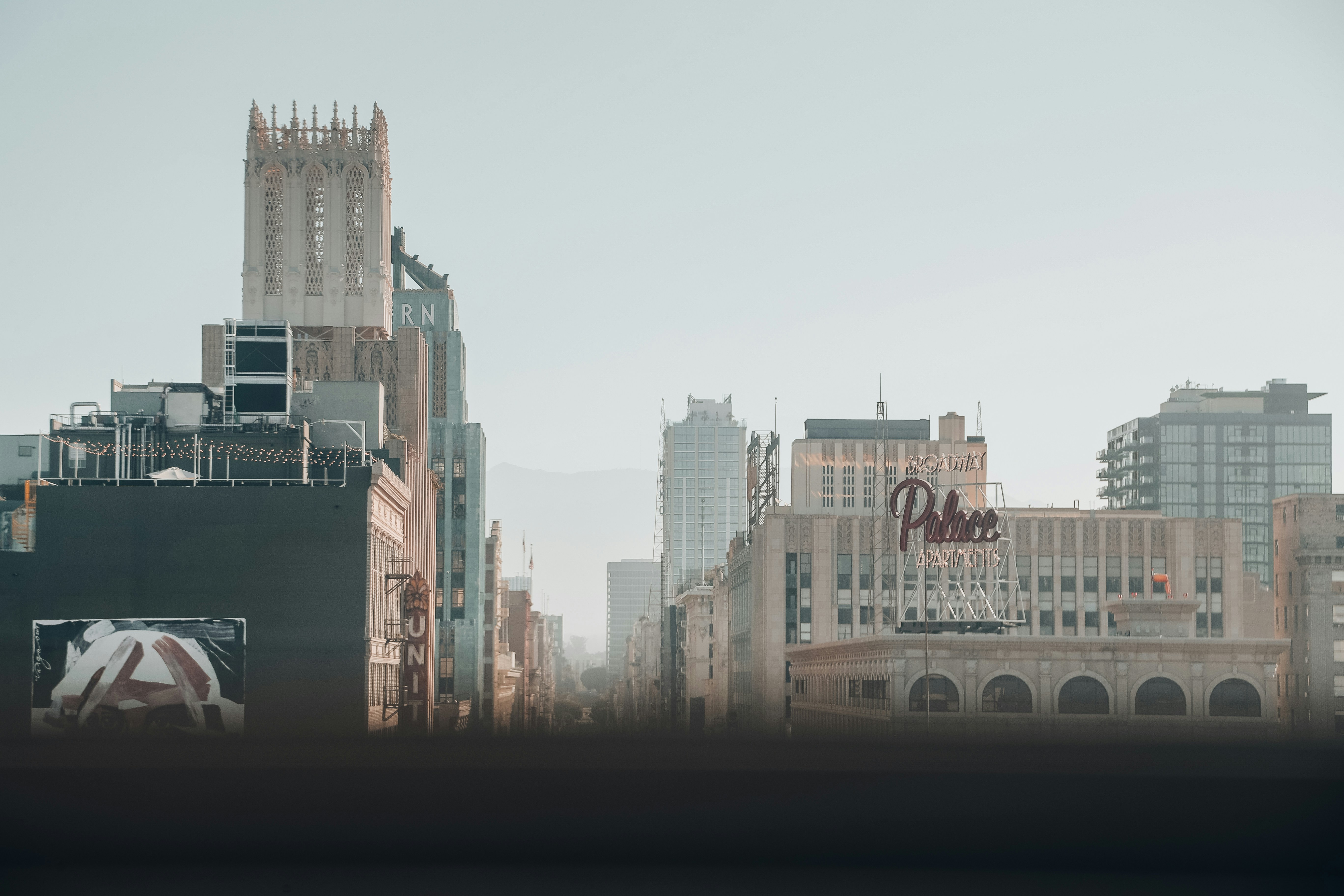 a city skyline with a bridge