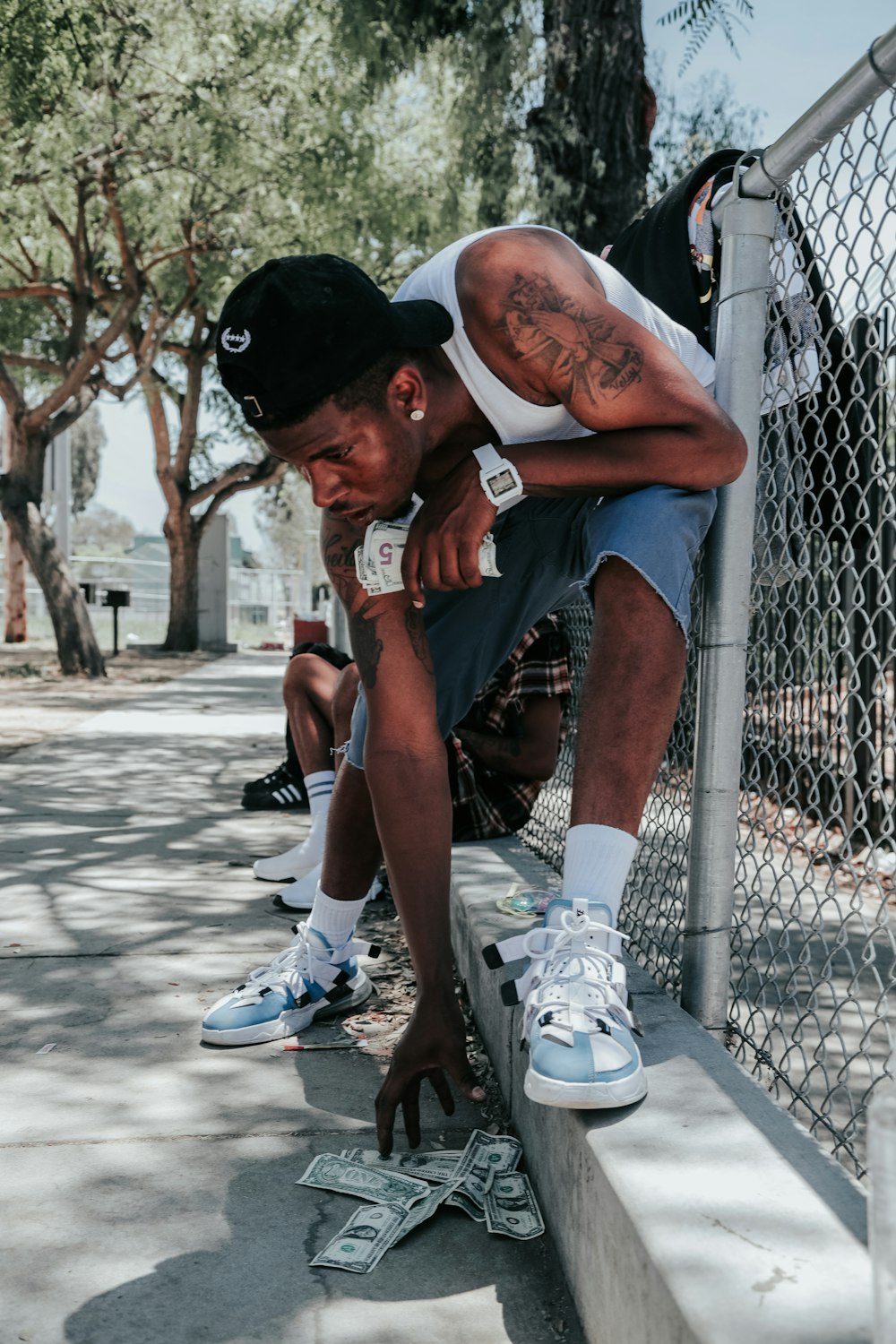 a man sitting on a fence