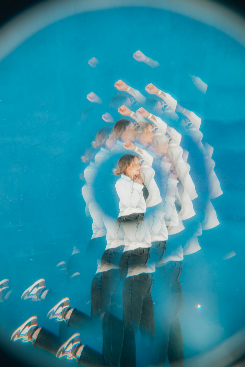 a group of people in a tank with fish