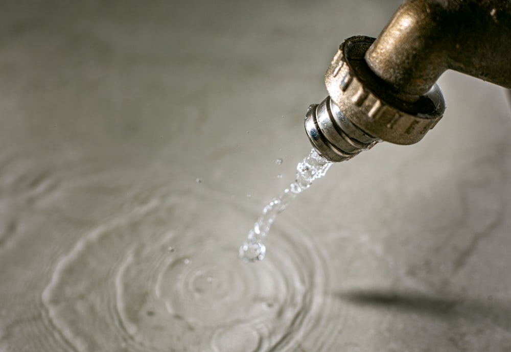 a drop of water falling into a glass