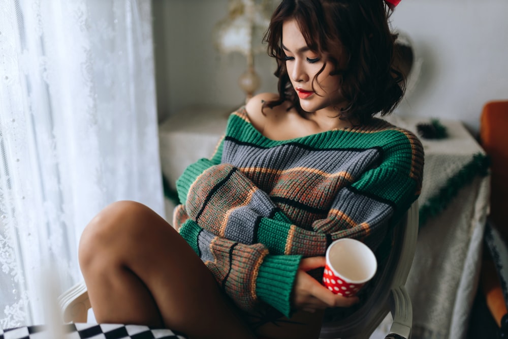 a woman sitting on a couch